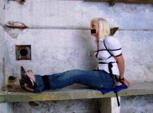 British woman is tied up and gagged in blue jeans and a white shirt - Britain on nudepicso.com