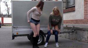 Katy Sky and Victoria Daniels duck behind a trailer for a much needed piss on nudepicso.com
