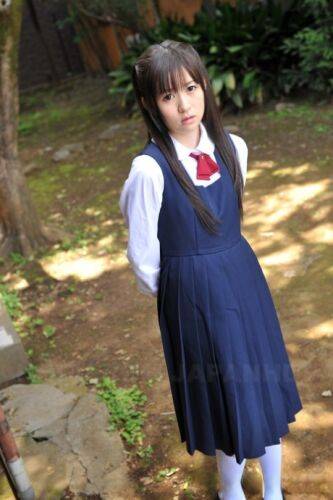 Charming Japanese babe posing in her cute school outfit in the garden - Japan on nudepicso.com