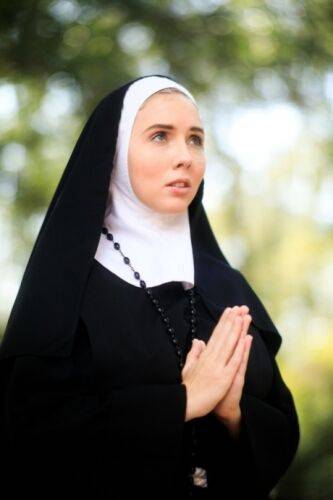 Thick Nun exposes herself in the courtyard wearing over the knee socks on nudepicso.com