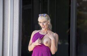 Naughty blonde flashes no panty upskirts and her big tits out in public on nudepicso.com