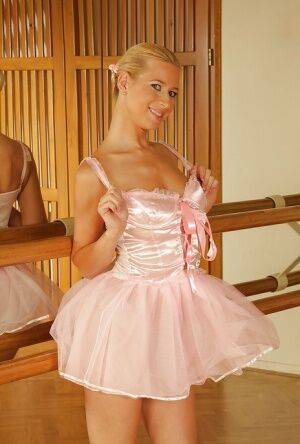Blonde babe Anastasia Devine takes off her sexy little ballerina getup on nudepicso.com
