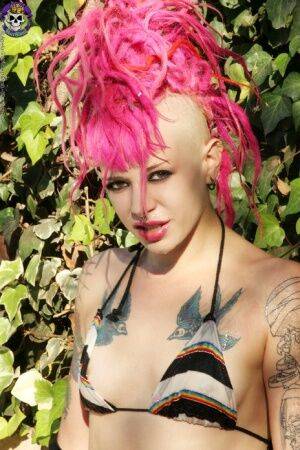 Pink haired tattooed punk girl by the pool on nudepicso.com