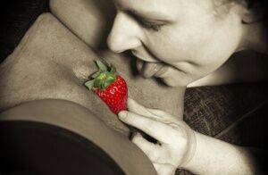 Mature lesbian Mollie Foxxx and her lover use strawberries during foreplay on nudepicso.com