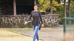 Busty Gabriellla Gucci in jeans undressing and pissing in public on nudepicso.com
