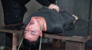 London River is mummified and tied down before being throat fucked in dungeon on nudepicso.com