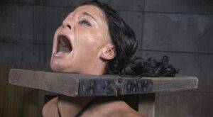 Restrained brunette London River is forced to suck a black penis on nudepicso.com