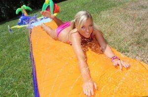 Young blonde Ally Kay ends a water fight by having sex in backyard on nudepicso.com