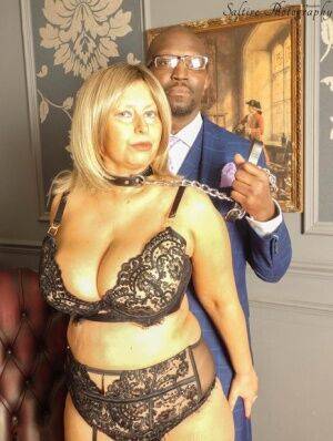 Overweight aged blonde Posh Sophia kneels afore her black owner while collared on nudepicso.com