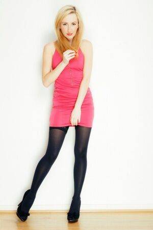 Blonde girl Sophia Smith exposes lace panties before posing nude in hosiery on nudepicso.com