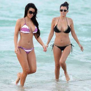 Teen celeb kim kardashian posing on the beach on nudepicso.com