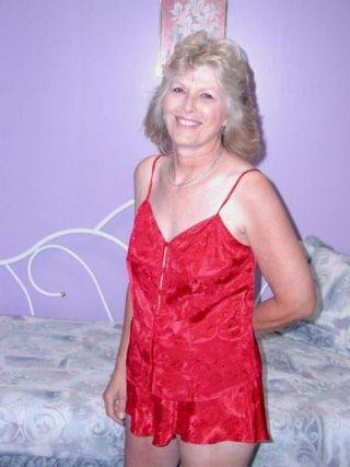 Classy granny in sexy red lingerie spreads hairy pussy on cam on nudepicso.com
