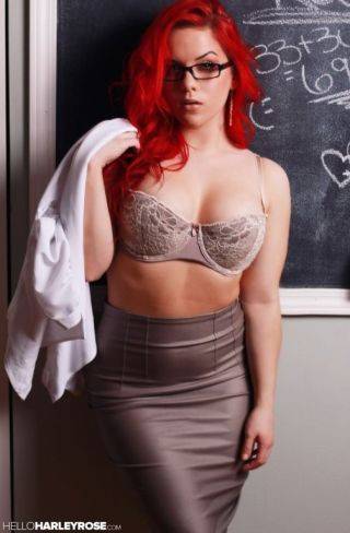 Redhead stripping on nudepicso.com