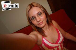 Hottie in glasses takes nasty photos of her bubbies and spread twat on nudepicso.com