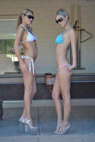 Busty blonde amateur babes in bikinis strip otudoors on nudepicso.com