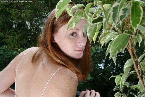 Svelte redheaded youthful Allison exposes big knockers and pussy outdoor on nudepicso.com