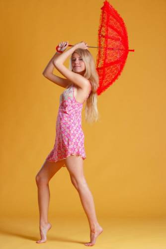 Leggy And Elegant Blonde Chick Barbara D Shows Off Her Fine Teen Bod With A Parasol on nudepicso.com