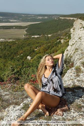 The Blonde Chick April E Has Climbed The Rocks To Expose The Nude Body To The Skies on nudepicso.com