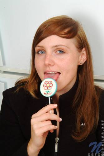 Red Haired Teen Babe Beth Nubiles Slowly Strips While Eating A Lollipop. on nudepicso.com