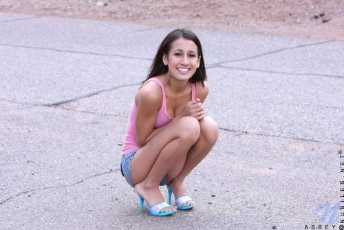 Frisky Teen Chic Amia Moretti Pulls Down Her Blue Shorts And Pink Panties Outdoors on nudepicso.com