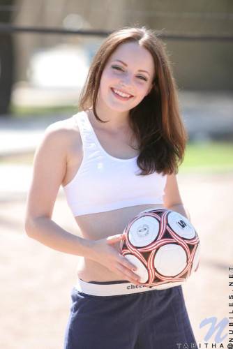 Smiling Sportive Girl Tabitha Nubiles In Snow White Top And Blue Shorts Poses With A Ball Outside on nudepicso.com