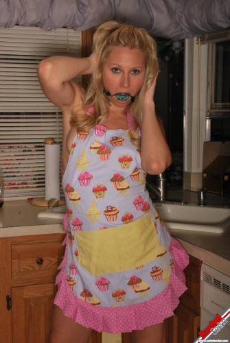 Gagged Bimbo Rachel Sexton Is Fooling Around In Dress And Half Nude In The Kitchen on nudepicso.com