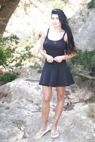 Inviting czech brunette Lucy Li in skirt showing big knockers and hairy beaver outside - Czech Republic on nudepicso.com