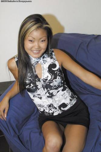 Hot asian teen Lucylee in nice skirt exhibits small tits and shaved pussy on nudepicso.com