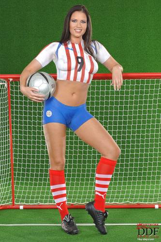 European Babe Veronica Da Souza In Painted Soccer Uniform Poses With A Ball on nudepicso.com