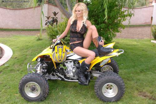 Lovely Blonde Hannah Hilton Dressed In Black Shows Her Assets On Quad Bike on nudepicso.com