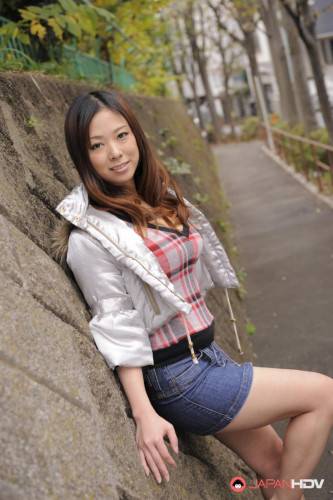 Asian Chick In A Short Jeans Skirt Asuka Is Sexily Posing In The Autumn City on nudepicso.com