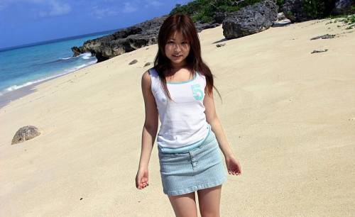 Girl Miyu Sugiura Is On The Beach Showing Off The Delicious Looking Thong Up The Skirt on nudepicso.com