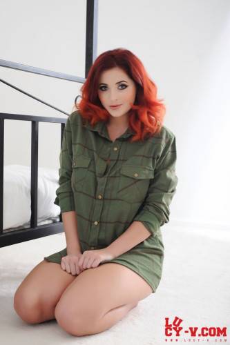 Real Redhead Beauty Lucy Vixen Unbuttons The Shirt And Uncovers View On Big Melons on nudepicso.com