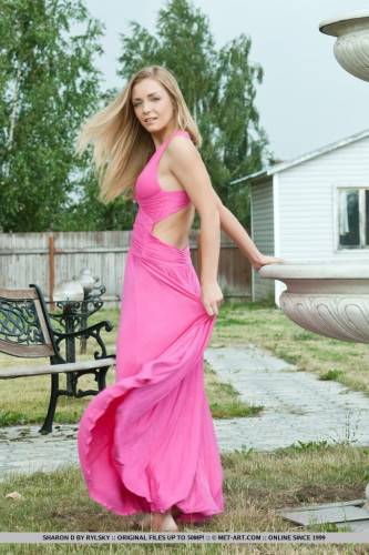 A Pink Dress Looks Great On Delicious Blonde Senta L As She Is Posing Outdoor. on nudepicso.com