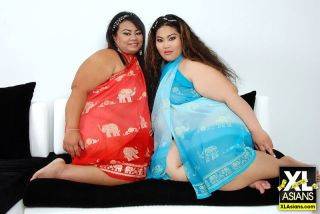 Asian bbws with huge asses kissing in lesbian sex pics on nudepicso.com