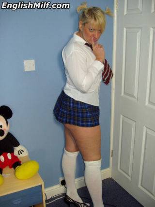 Curvy mom teasing in her schoolgirl outfit - Britain on nudepicso.com