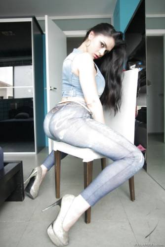 Charming latin brunette Marta La Croft in jeans revealing big tits and sexy ass on nudepicso.com