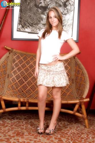 Stunning teen Fiona Rossi in sexy skirt unveiling tiny tits and spreading her legs on nudepicso.com