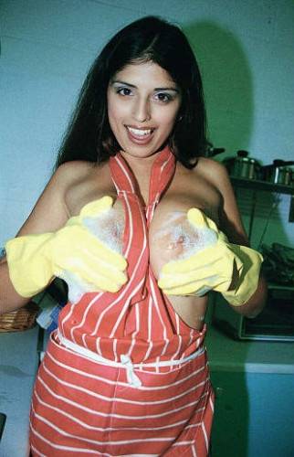 Naughty Housewife Kerry Marie In Yellow Gloves Demonstrates Her Huge Jugs And Twat on nudepicso.com