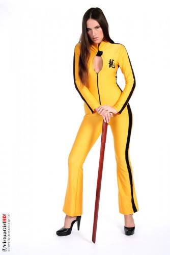 Deny Is Such A Hot Brunette, Dressed In A Kill-bill Style Yellow Suit Looking Sexy. on nudepicso.com