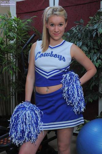 Cheerleader Kristi Kay Takes Off Her Blue Uniform And Displays Her Smooth Pink Pussy on nudepicso.com