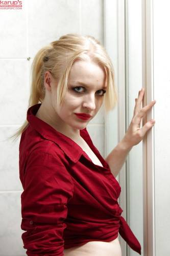 Stunning latvian blond cutie Bella Lei baring big titties and spreading her legs in the bathroom - Latvia on nudepicso.com