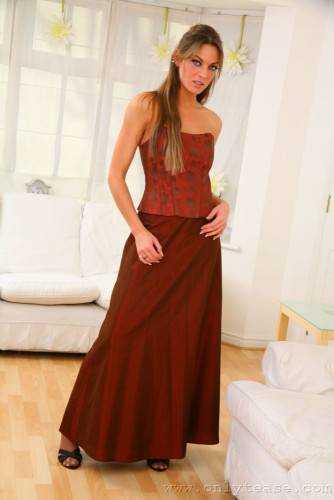 Fascinating Ali C Has Stockings And Garters Under Her Stylish Red Evening Gown on nudepicso.com