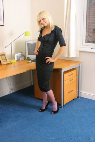 Sexy Blonde Secretary In Black Suit And Purple Nylons Gets Sexy In The Office on nudepicso.com