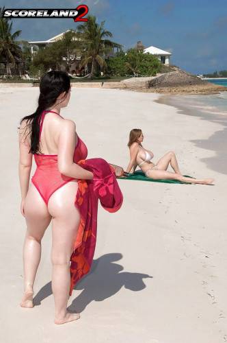Lush girls Angela White and Christy Marks kissing andhaving fun with toy on the beach on nudepicso.com