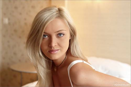 Lusty Blonde Hottie In Lingerie Nelly A Enjoys In Stripping And Teasing On The Bed on nudepicso.com