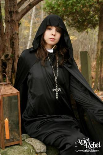 Naughty Teenage Nun Ariel Rebel Dressed In Black Flashes Her Bald Pussy Outdoors on nudepicso.com