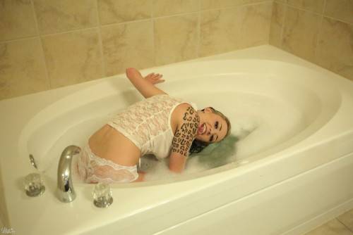 Aroused Passionate Lily Xo Poses In The Bath Tub And Teases With Pleasure on nudepicso.com
