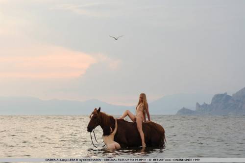 Naked Slender Lesbian Friends Dariya A And Lera B Ride The Horse Naked Together At The Seaside on nudepicso.com