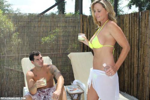 Busty Blonde MILF Jodi West Wraps Her Arms Around A Young Stud And Blows His Boner Poolside. on nudepicso.com